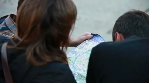 Three boys consult a map Stock Footage 8881086