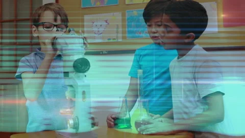 Three boys lifting microscope to eye, collaborating adjusting sample focus for Stock Footage 316185178