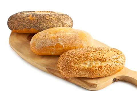 Three breads on the wooden plank Stock Photos