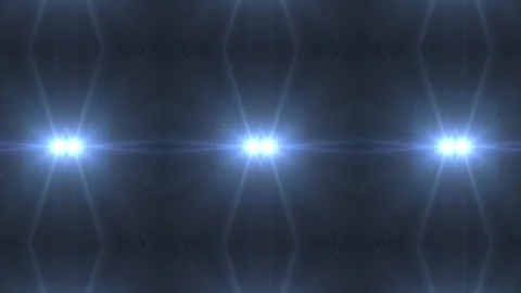 Three bright blue lights shine against a dark backdrop Video stock 340528785