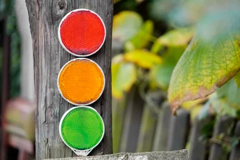 Three bright reflective elements on the stick, yellow red and green, traffic  스톡 사진
