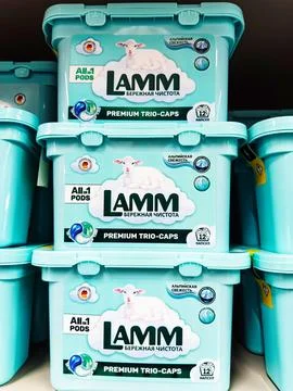 Three bright turquoise containers with LAMM cleaning capsules. Each container Stock Photos