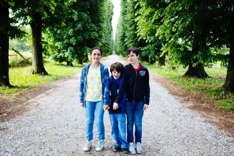 Three brothers portrait in a tree lined avenue Stock Photos