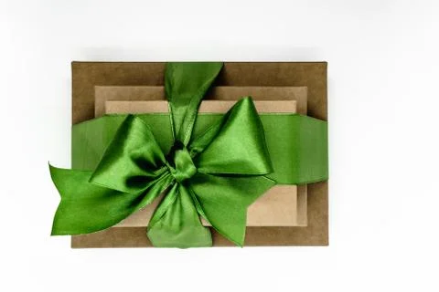 Three brown carton gift boxes bundled with green ribbon Stock Photos