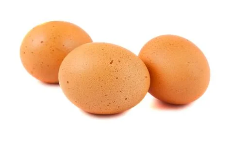 Three brown chicken eggs Stock Photos