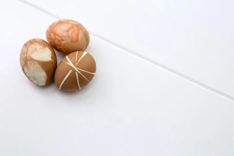 Three brown easter eggs isolated on white. Stock Photos