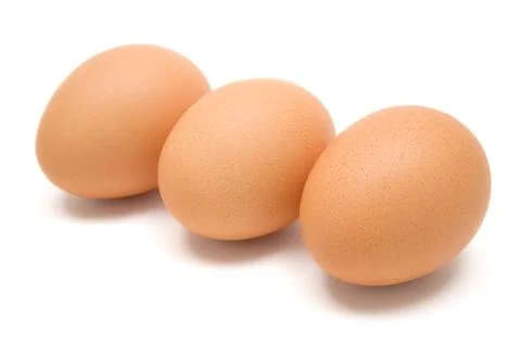 Three Brown Eggs Isolated on a White Background Foto stock