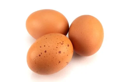Three brown eggs isolated on white background Stock Photos