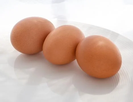Three brown eggs  Photos