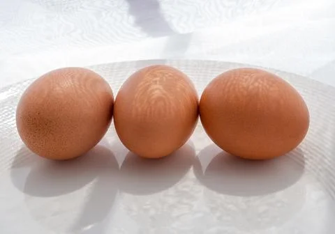 Three brown eggs  Photos