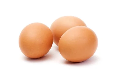 Three brown eggs on white background Stock Photos