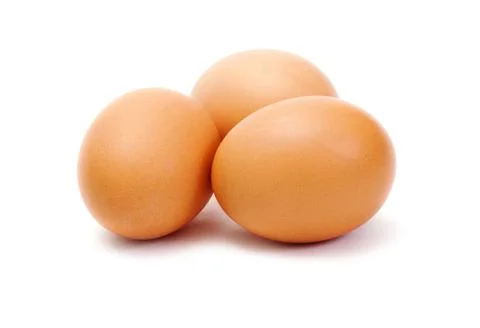 Three brown eggs on white background Stock Photos