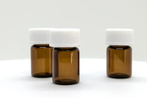 Three Brown Sample Bottles with White Caps Stock Photos