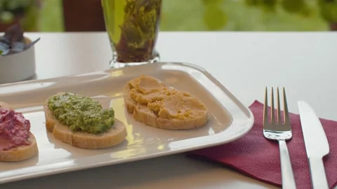 Three bruschetta with vegetable pate Stock Footage 137628483