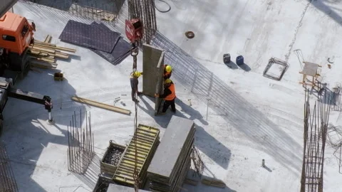 Three builders installing concrete slab at the construction site Stock Footage 236474030