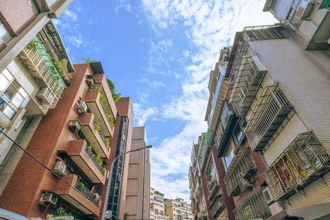 Three building between the road which constructed by brick Stock Photos