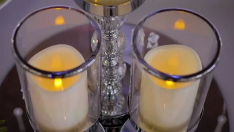 Three burning candles on a candlestick. Wedding decorations. Stock Footage 101778983