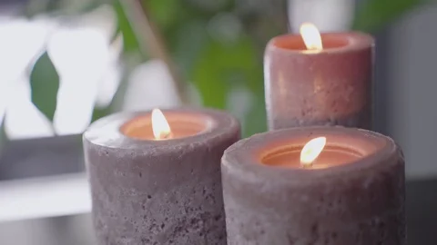 Three  Burning Candles Close-up. Burning of Three Candles. Video stock 97699984
