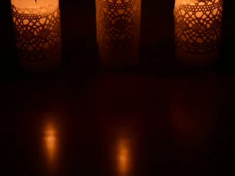 Three burning candles in the dark Stock Footage 71811544