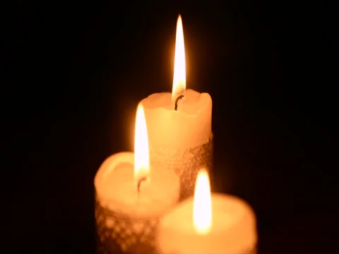 Three burning candles in the dark Stock Footage 71811886