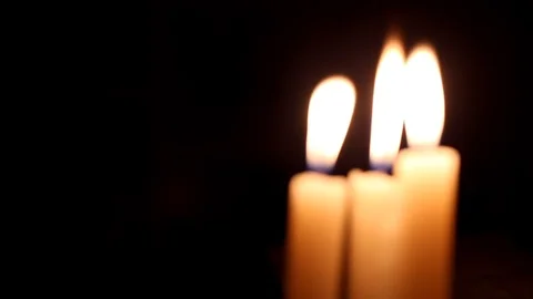 Three burning candles at a dark room 動画素材 88713437