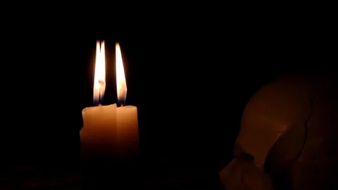 Three burning candles at a dark room Stock Footage 88713439