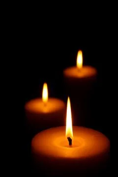 Three burning candles Foto stock