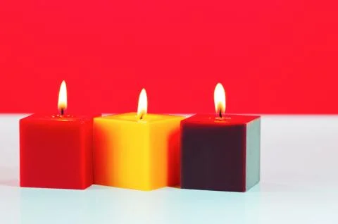 Three burning candles Stock Photos