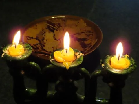 Three burning candles Stock Photos