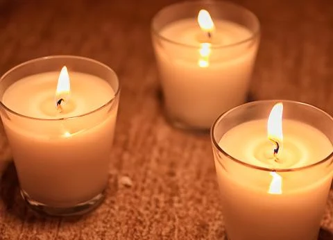 Three burning candles Stock Photos