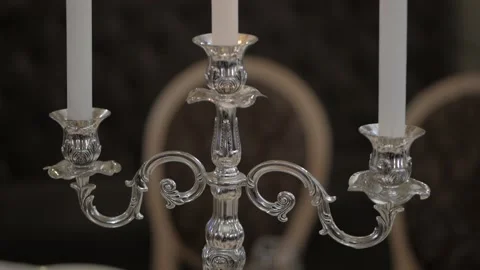 Three burning candles on a vintage old candlestick, wedding decorations. Stock Footage 89670191