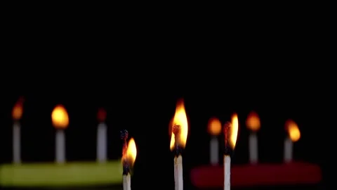 Three Burning Matches with a Bright Flame on a Black Background in Empty Space Stock Footage 253773385
