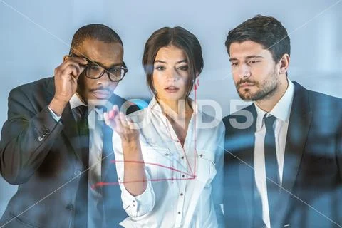 The three business people draw at the virtual screen Stock Photos