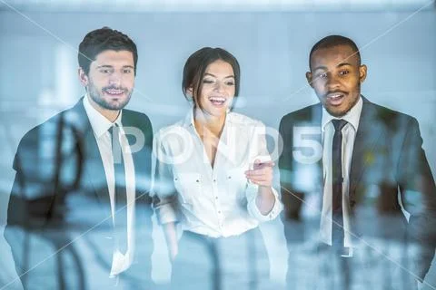 The three business people stand near the window Stock Photos