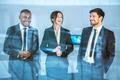 The three business people stand over the window Photo