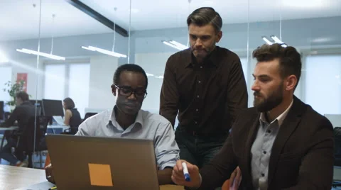 Three businesspartners discussing new projects Stock Footage 68344944