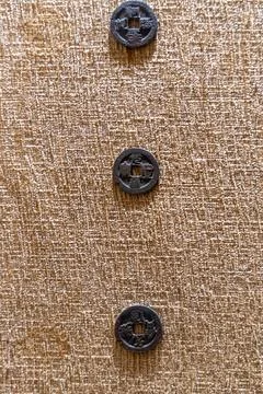 Three buttons are on a tan background. in Chennai Stockfoto's
