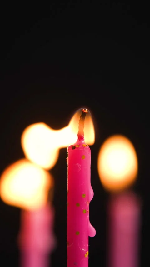 Three cake candles burning on a black background. Stock Footage 305516711