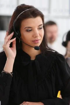 Three call centre service operators at work Stock Photos