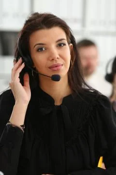 Three call centre service operators at work Stock Photos