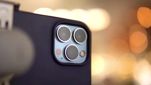 Three cameras on the back of the smartphone on a beautiful background Stock Footage 266276288