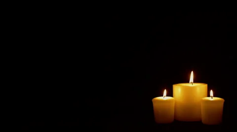 Three candles on black background Video stock 37527568