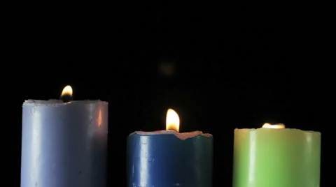 Three candles on black background Video stock 57214992