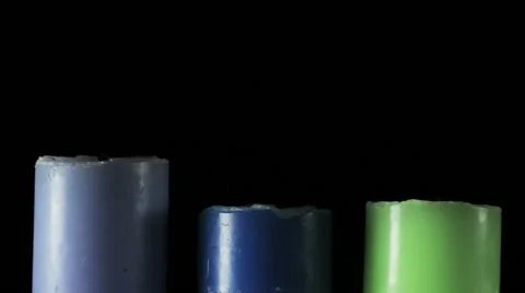 Three candles on black background Vidéo 57215017