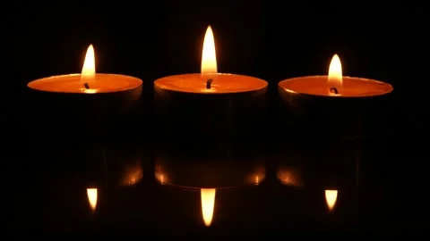 Three Candles On Black Background Видео 267549396