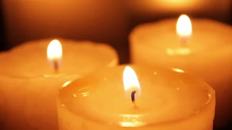 Three candles blazing in the dark Stock Footage 47255092