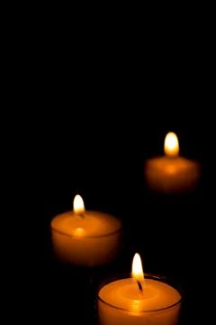 Three Candles in the Dark Stock Photos