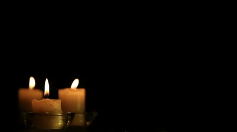 Three candles in the left corner. Stock Footage 7735250