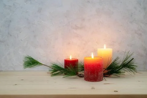 Three candles lit for the third Advent, pine branch as a simple, minimal d... Foto stock