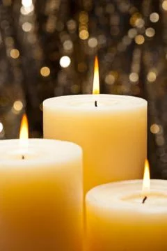 Three candles Stock Photos
